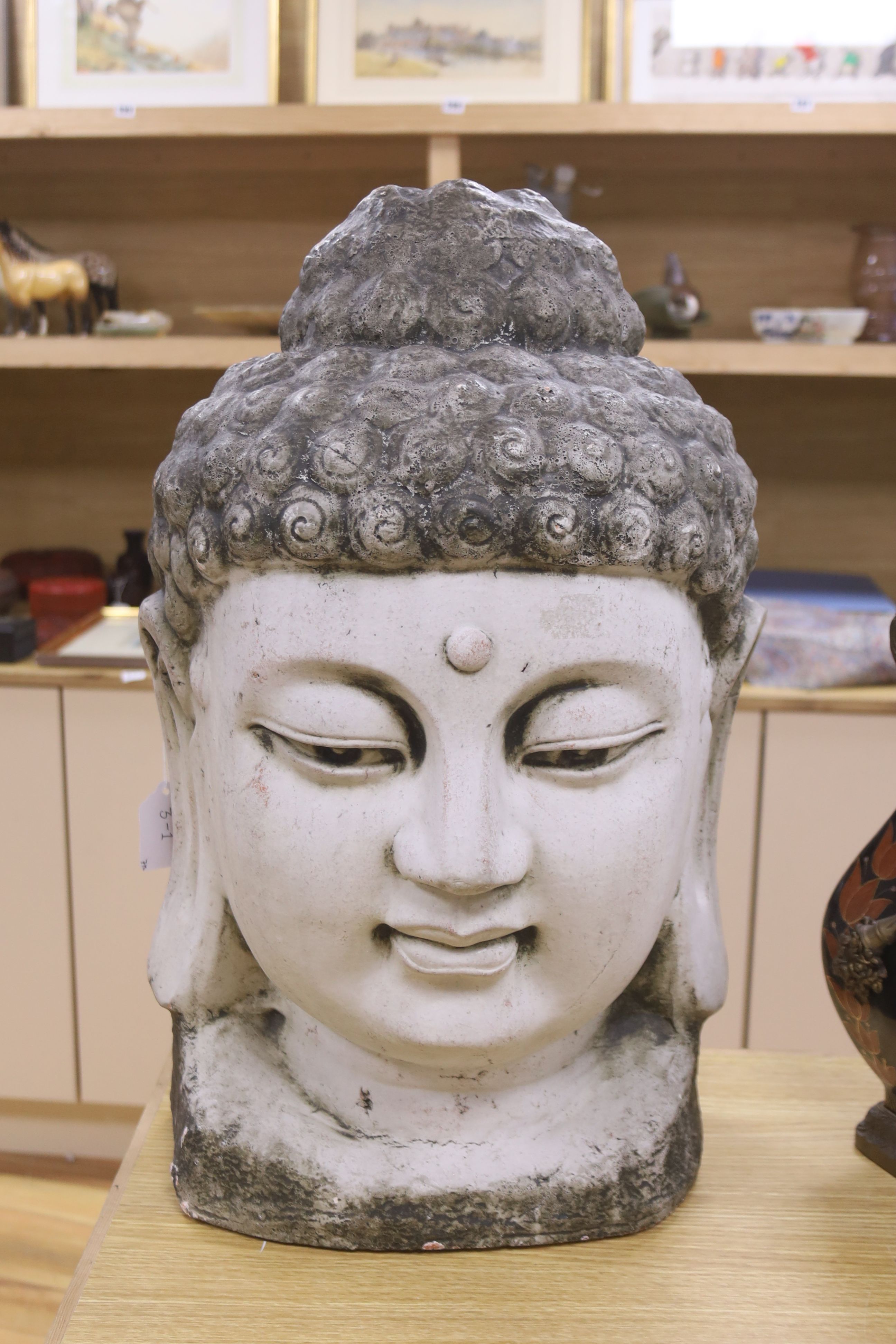 A large white painted terracotta Buddha head, height 57cm
